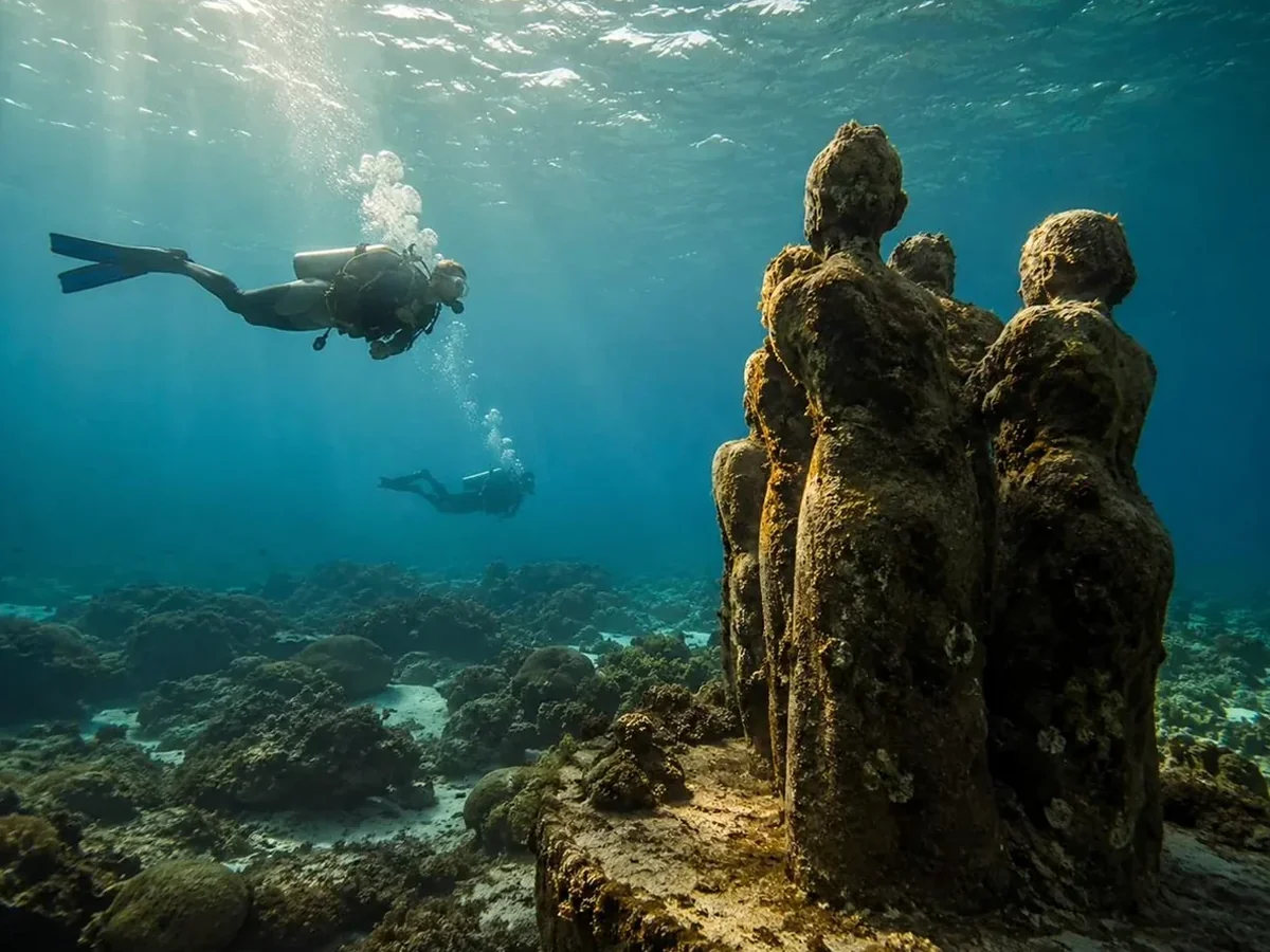 MUSA's submerged figures, slowly gathering coral