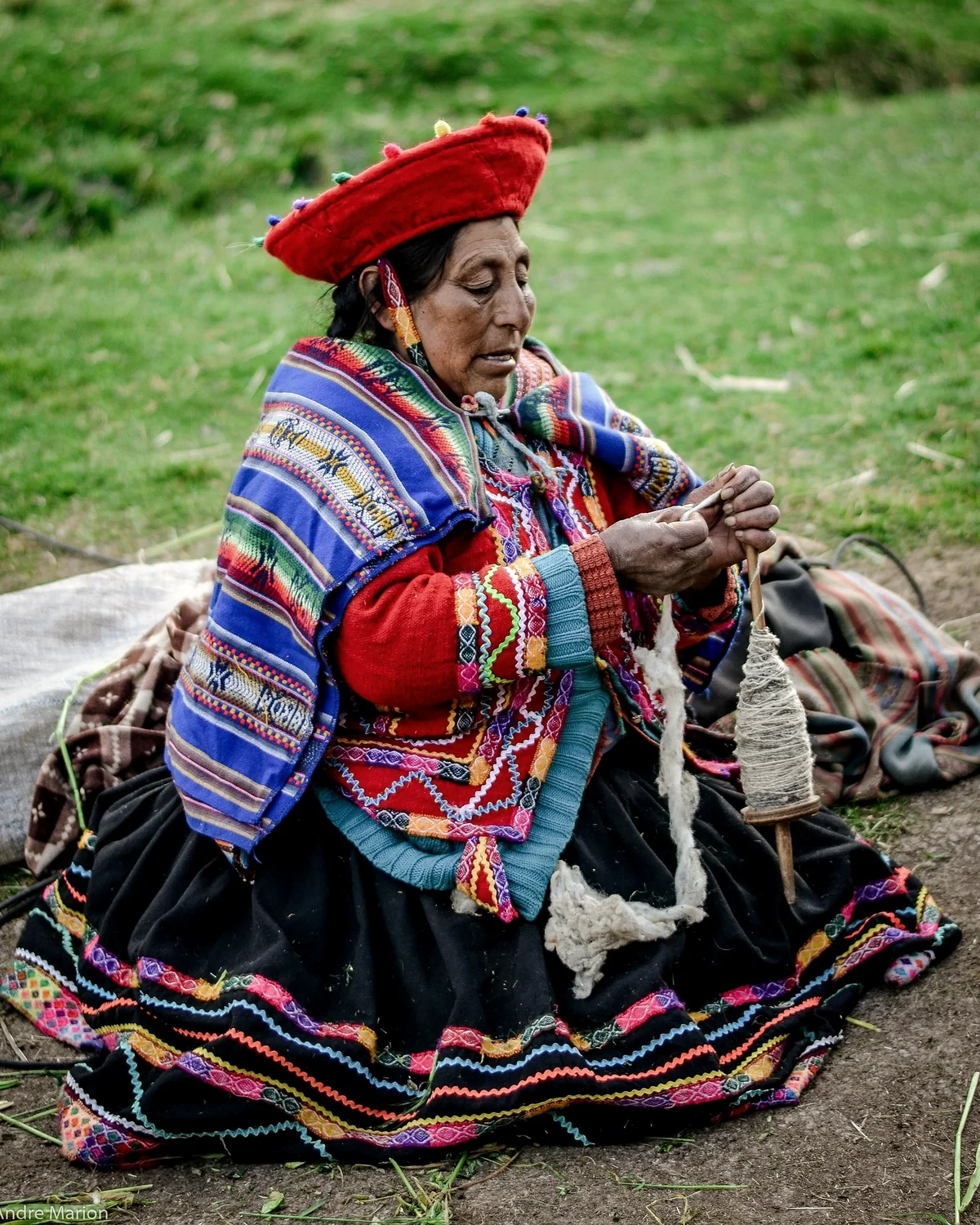 Wool drawn onto a drop spindle, by hand and without a wheel