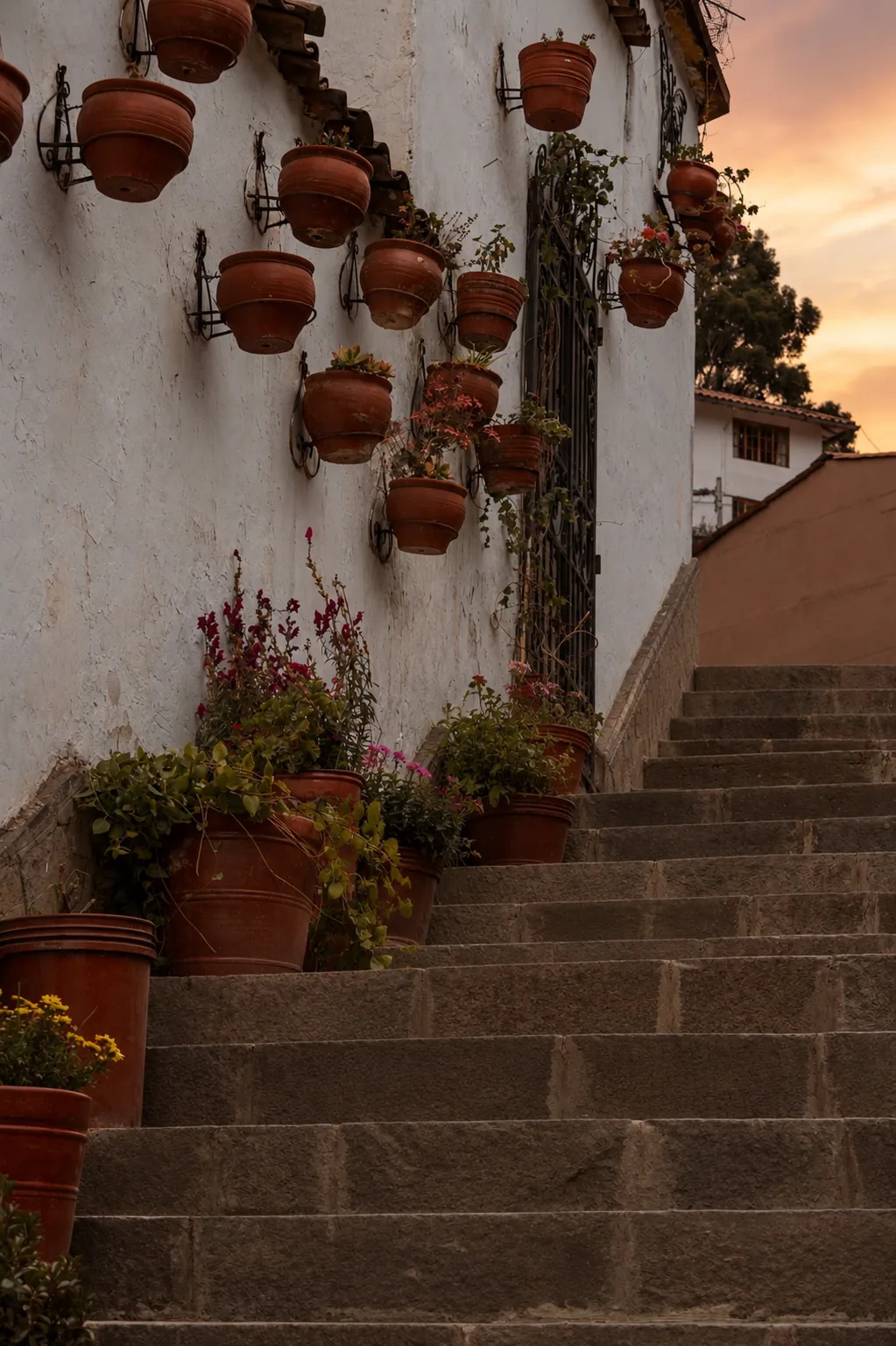 A quiet stone stairway in San Blas above Cusco at sunset