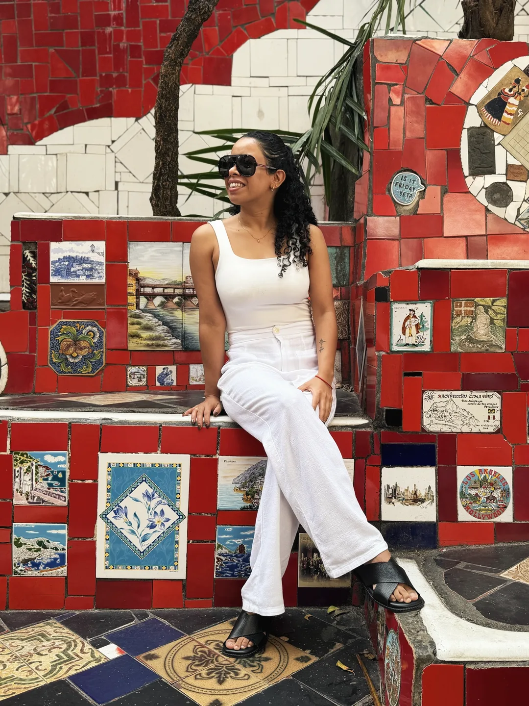 Melissa sitting on the tiled Selarón Steps in Rio de Janeiro