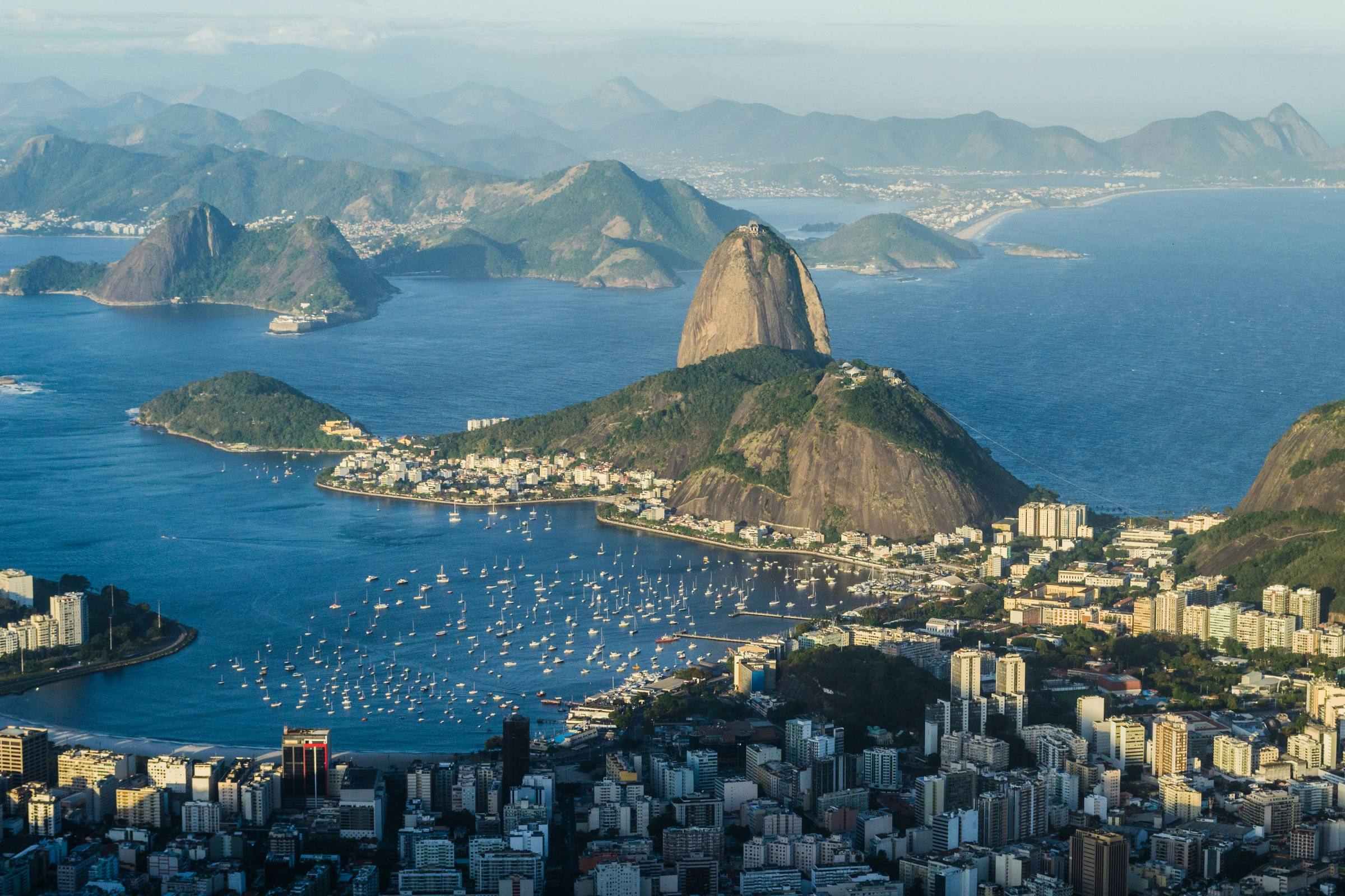 Botafogo Bay seen from above, boats moored in the marina and Sugarloaf standing over the city