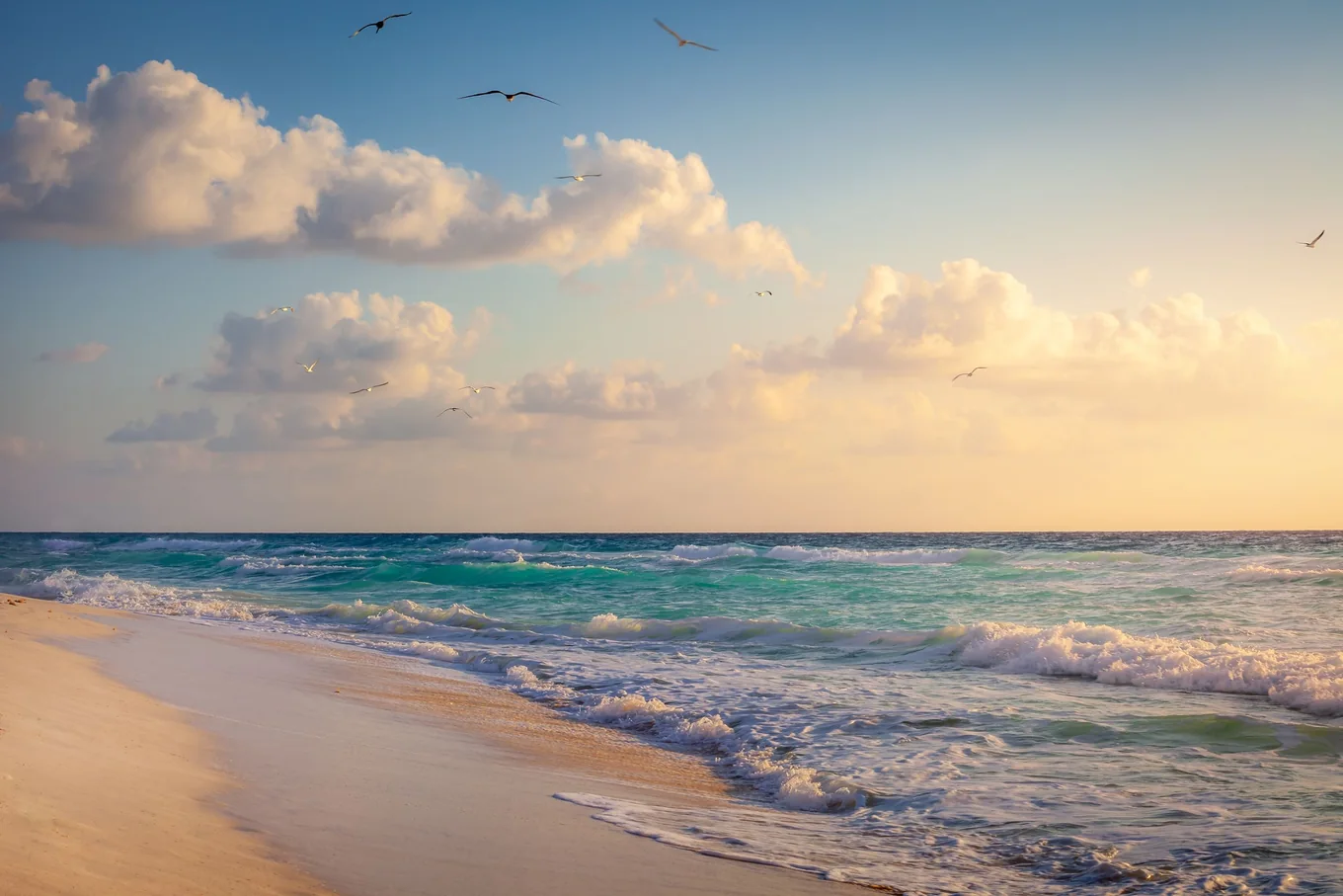 White sand beach and Caribbean surf near Cancún