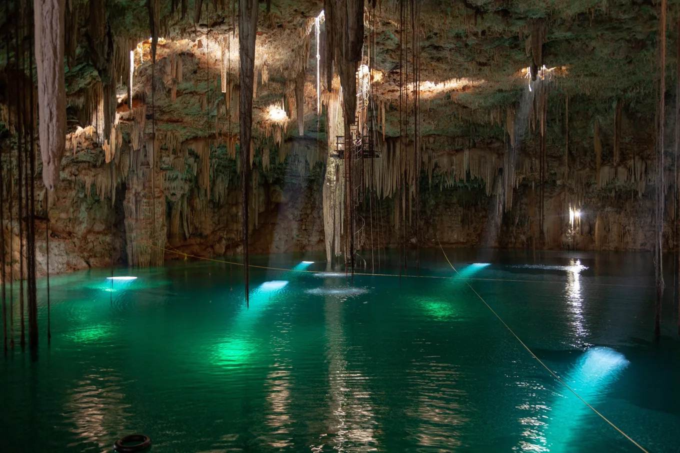 A cave cenote at Yalcobá, lit from under the water