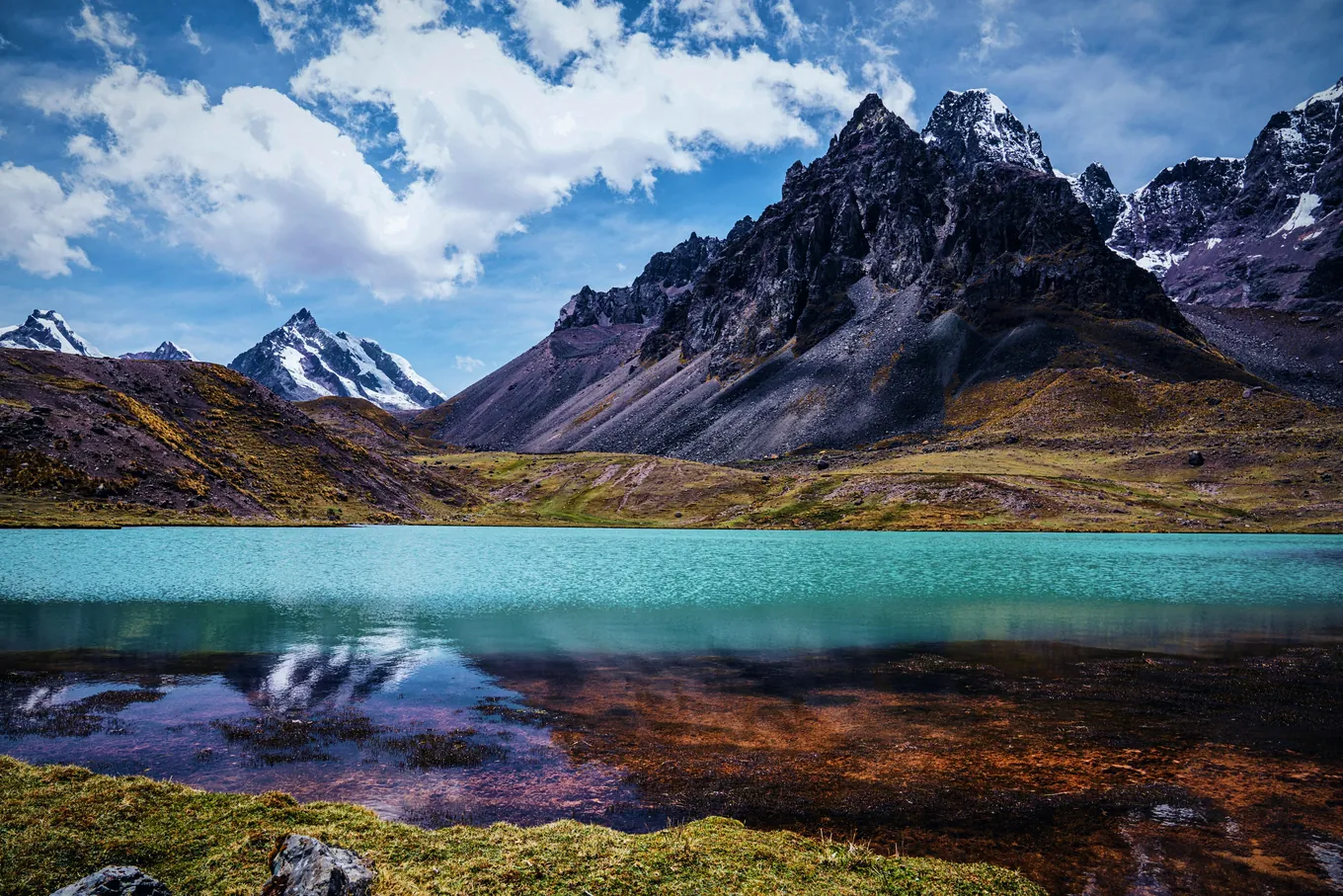 A lake below the dark peaks of the Ausangate range