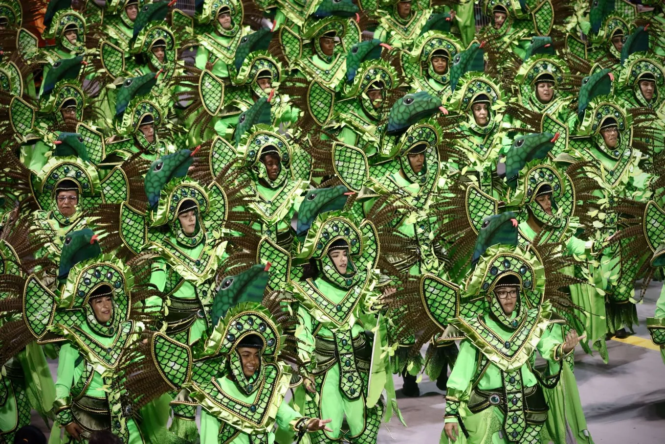 A wing of the parade in matching green costumes