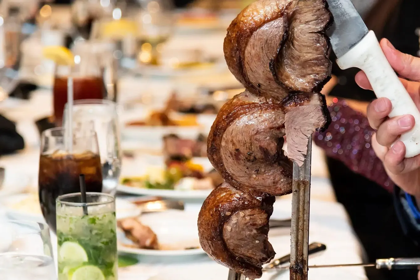 Picanha carved from the skewer at the table