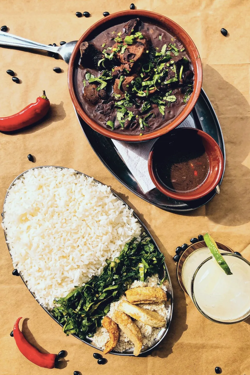 Black beans and meat, rice, greens, farofa, and pork rinds