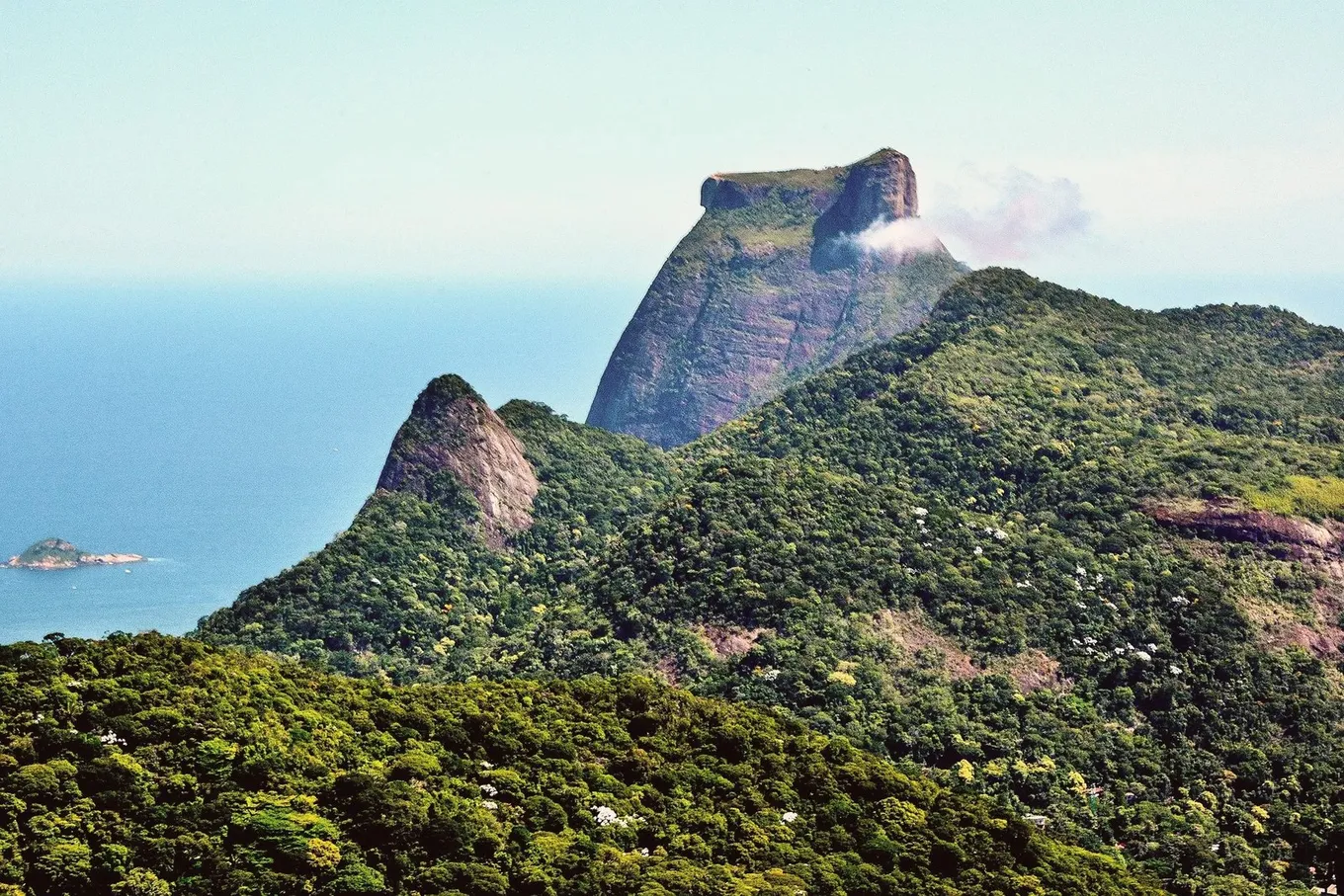 Pedra da Gávea rising above the forest and the sea