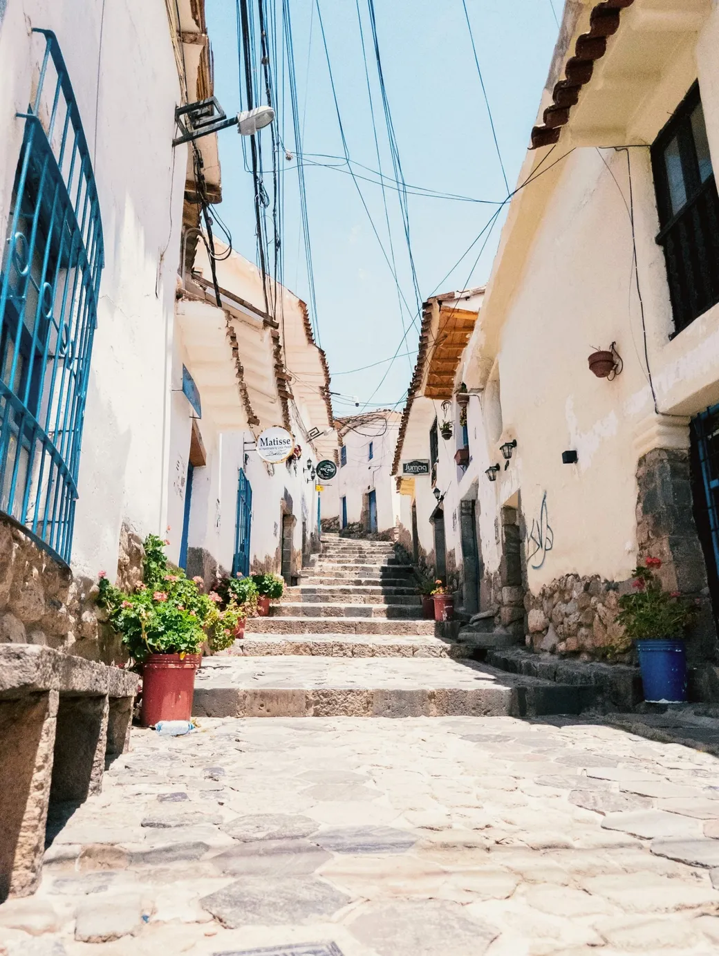 A steep whitewashed lane climbing in stone steps